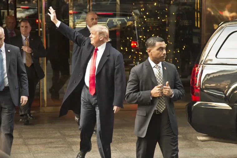 Donald Trump waives in 2015 to a crowed outside Trump Tower in Manhattan as he heads to the nearby Republican luncheon that kicks off Pennsylvania Society, an annual political retreat. Trump was greeted at that event with tepid GOP support and angry protesters.