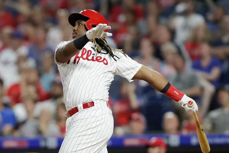Maikel Franco watches his fifth-inning home run against the Mets.