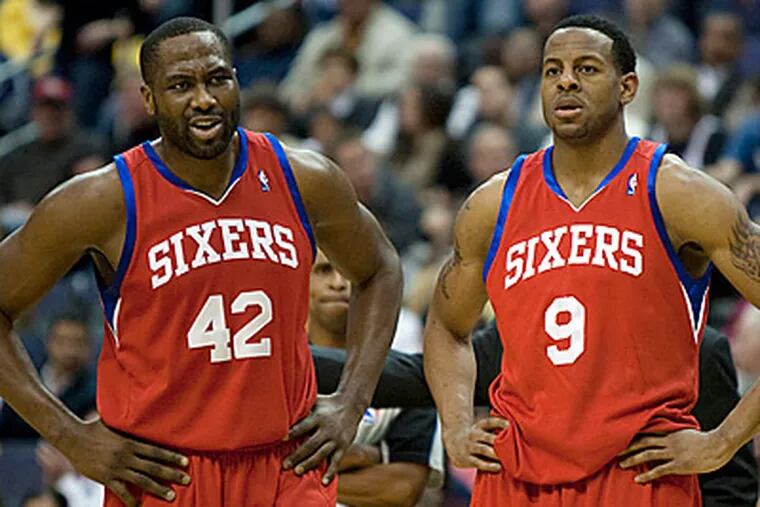 Elton Brand, left, and Andre Iguodala look on after a technical foul call against the 76ers during their loss to the Wizards. (AP Photo/Evan Vucci)