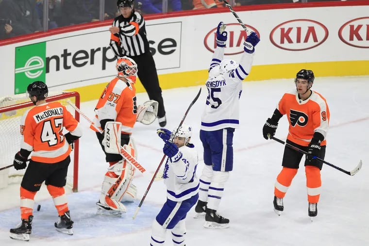 James van Riemsdyk (second from right) celebrates after scoring a goal against the the Flyers while with Toronto last season. He returns Monday as a Flyer against the Islanders in a preseason game.
