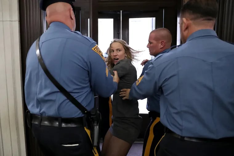 Two weeks after police dragged progressive activist Sue Altman out of a statehouse hearing room for no apparent reason, political insiders are consumed with every detail surrounding this year’s most viral moment in Garden State politics.