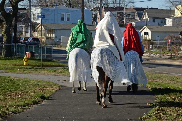 Celebrating Día de los Reyes Magos in 2016, the wise men arrive on horseback bringing gifts for the children at St. Andrews Episcopal Church.