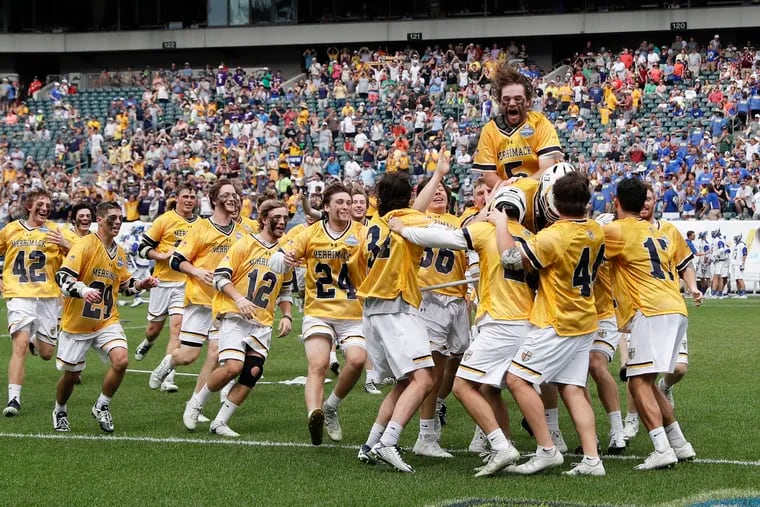 Merrimack players celebrate their NCAA Men's Lacrosse Division II champion win after beating Limestone 16-8.