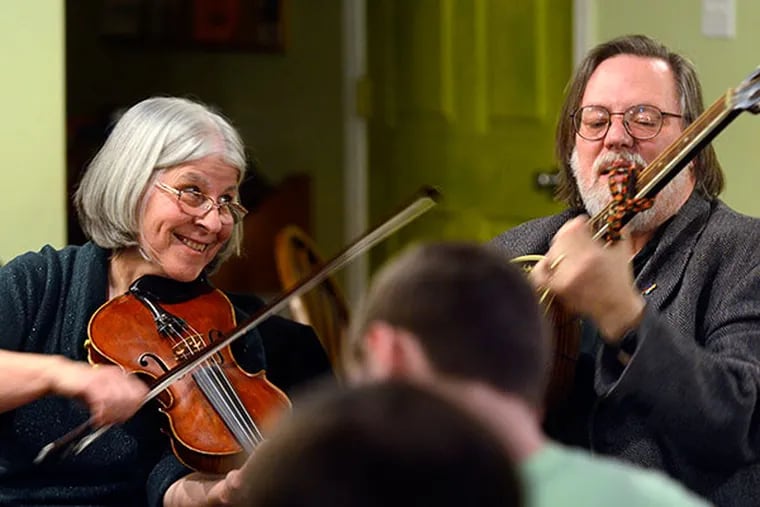 Dennis Gormley and Kathy DeAngelis, of Voorhees, perform at the weekly Celtic music "session" at the Treehouse coffeehouse in Audubon on February 27, 2014.  ( TOM GRALISH / Staff Photographer )