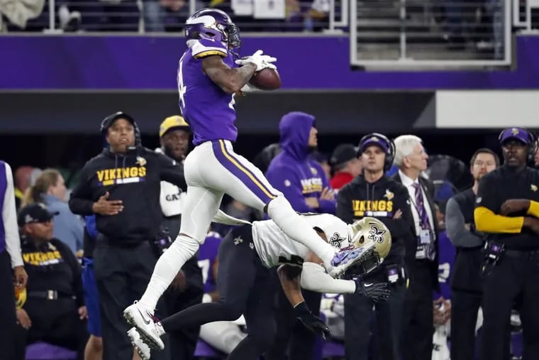 Minnesota Vikings wide receiver Stefon Diggs (14) makes a catch over New Orleans Saints free safety Marcus Williams (43) on his way to the game winning touchdown during the second half of an NFL divisional football playoff game in Minneapolis, Sunday, Jan. 14, 2018. The Vikings defeated the Saints 29-24. (AP Photo/Jeff Roberson)