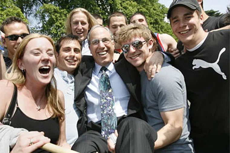 Stephen Spinelli Jr. is lifted by some Philadelphia University students. He will preside over his first commencement.