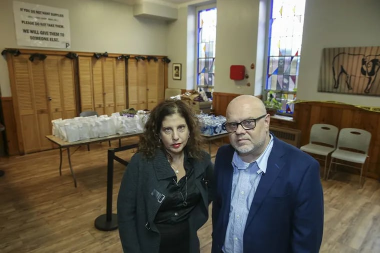 Ronda Goldfein and Jose Benitez of Safehouse's board, pose at Prevention Point, the city's only needle exchange. (Steven M. Falk/Philadelphia Inquirer/TNS)