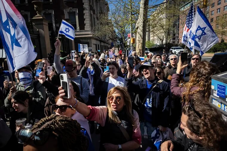 Pro-Israel demonstrators chant "Shame" in support of Columbia University assistant professor Shai Davidai, who was denied access to the main campus to prevent him from accessing the lawn currently occupied by pro-Palestine student demonstrators, on Monday, April 22, 2024.