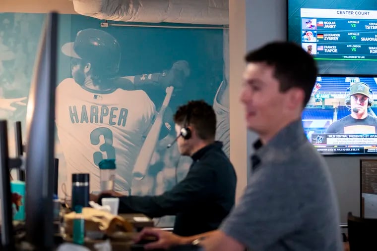 A wall of Philadelphia athletes including Bryce Harper is displayed at Kambi’s Philadelphia office. Kambi is a sports book technology company helping lead a new generation of artificial intelligence in sports betting.