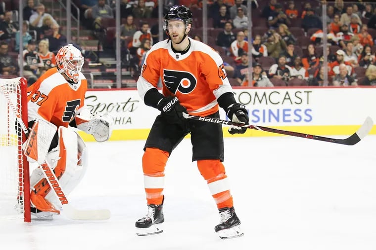 Defenseman Andrew MacDonald (right) was back in the Flyers' lineup Thursday after sitting out four games.