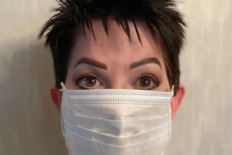 Makeup artist Cindy Singer showing off her eyes behind the mask. Her tip. Dust neutral eyeshadow above the lid,  use liquid eyeliner on the top and bottom lid and a heavy dose of mascara. And of course make sure your brows are arched, they frame the face.