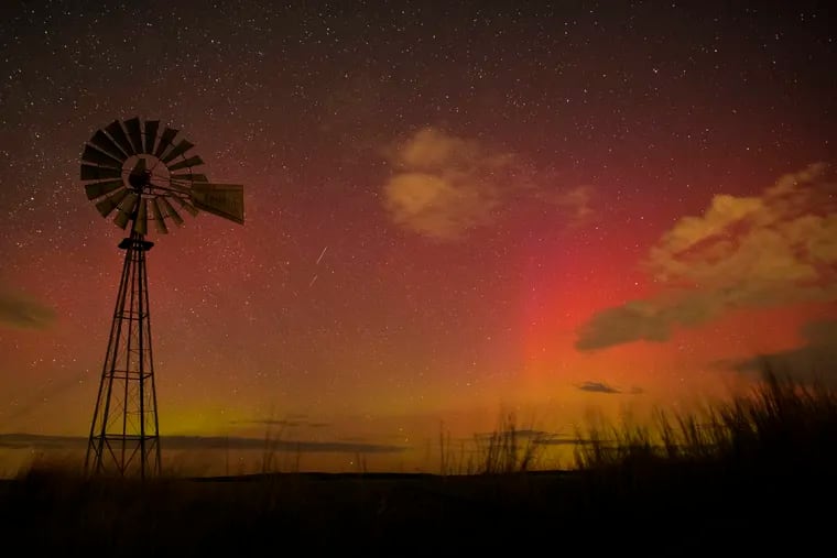 The northern skies glowing pink and orange with the aurora borealis near Walla Walla, Wash., in March.