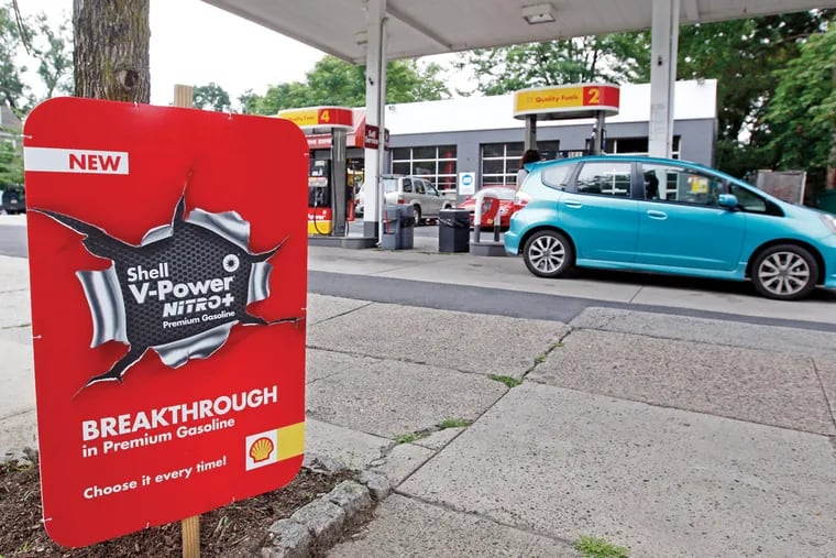 Shell station on Germantown Ave in Chestnut Hill advertising the new V-Power Nitro+ gasoline at their station while someone fills up their car. ( Michael Bryant / Staff Photographer )