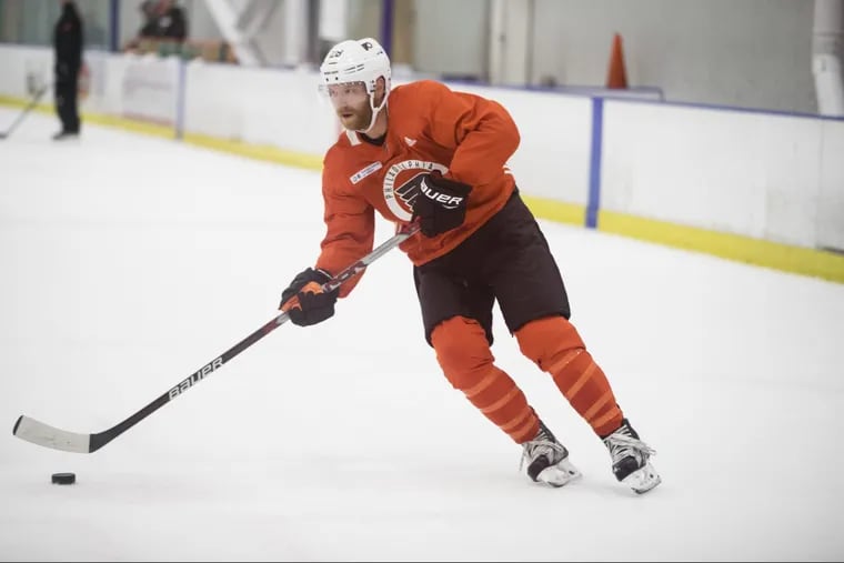 Claude Giroux played left wing on a line with Sean Couturier and Jake Voracek on Monday night.