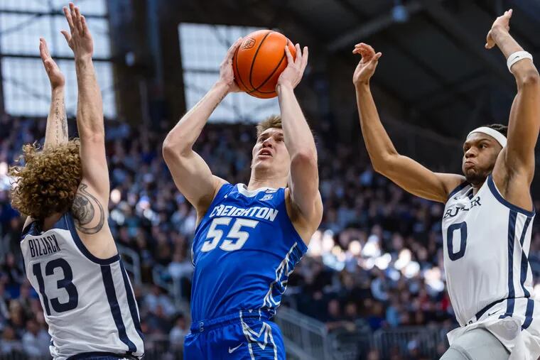 Baylor Scheierman #55 of the Creighton Bluejays shoots the ball against Finley Bizjack #13 of the Butler Bulldogs during the first half at Hinkle Fieldhouse on February 17, 2024 in Indianapolis, Indiana.
