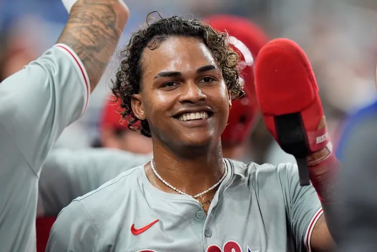 Cristian Pache, seen here being congratulated by teammates on Friday, was the cause of celebration again on Saturday in Miami after going 3-for-4 in back-to-back Phillies victories against the Marlins.