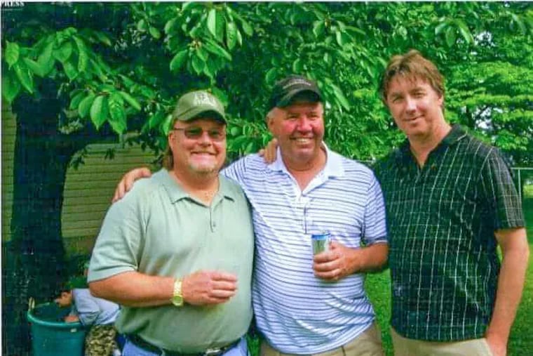 Jeffrey Carter, left, was described by friends as a "family man." He was killed after being hit by a stray bullet near Lincoln High School, his alma mater, on Monday afternoon. His longtime friend, Robert Offenback, is pictured in the middle.
