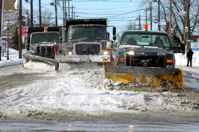 File photo: A snow plow train moves along Maple Avenue on the border between Pennsauken and Cherry Hill.