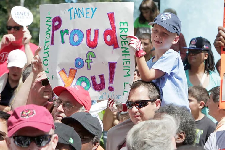 A young fan shows some Dragon love at LOVE Park. Next up for the Taney team: a parade Wednesday.
