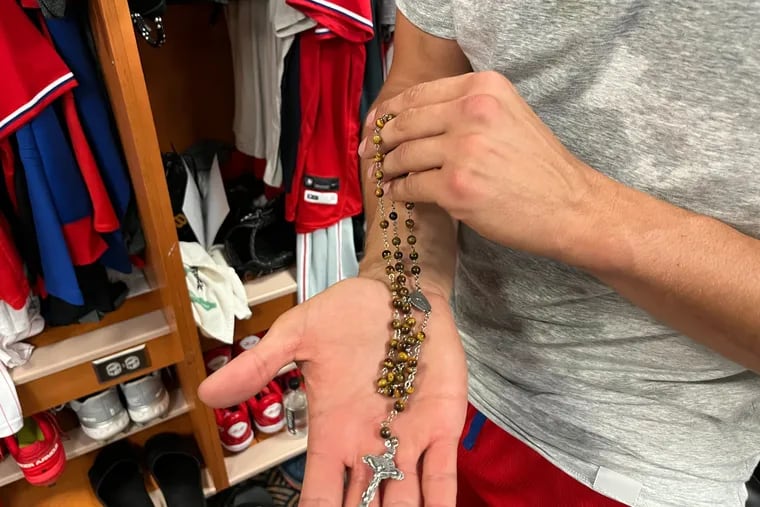 Aaron Nola's rosary, which he keeps in his back pocket for every start.
