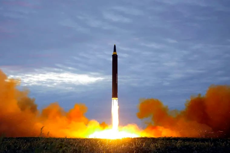 FILE - This Aug. 29, 2017, file photo by the North Korean government shows what was said to be the test launch of a Hwasong-12 intermediate-range missile in Pyongyang, North Korea. North Korea on Thursday, Dec. 20, 2018, says it will never unilaterally give up its nuclear weapons unless the United States removes its nuclear threat first. (Korean Central News Agency/Korea News Service via AP, File)
