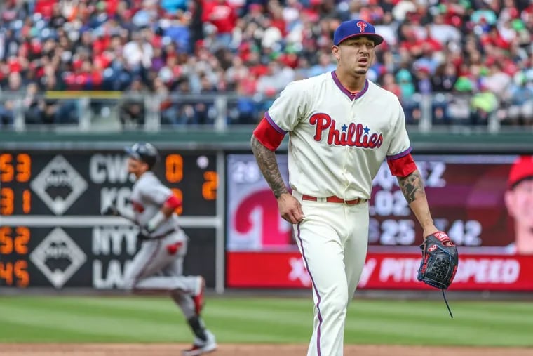 Phillies pitcher Vince Velasquez is not happy in the top of the third inning as Atlanta’s Johan Camargo rounds the bases after hitting a three-run home run.