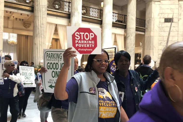 Parking workers and 32BJ SEIU members rallied at the Ritz Carlton after the City Council hearing on two bills to regulate the parking industry.