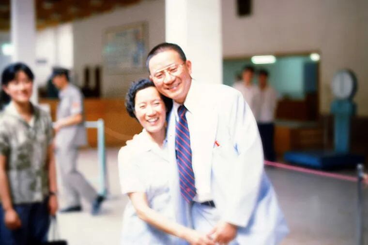 Dr. Paul M. Lin, who fled China in 1949, reunites with his older sister Martha at the Shanghai airport on June 17, 1979