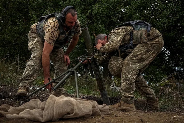 Ukrainian soldiers preparing a mortar launcher at a position along the front line in the Donetsk region on Monday.