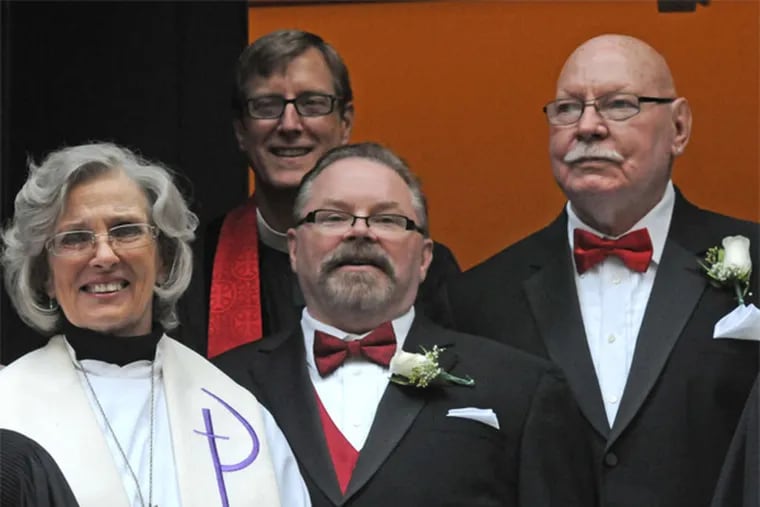 Newlyweds Taylor (center) and Gatewood (right) have been together for 25 years. &quot;I've been wanting to do this all my life,&quot; Gatewood said. &quot;In church.&quot;