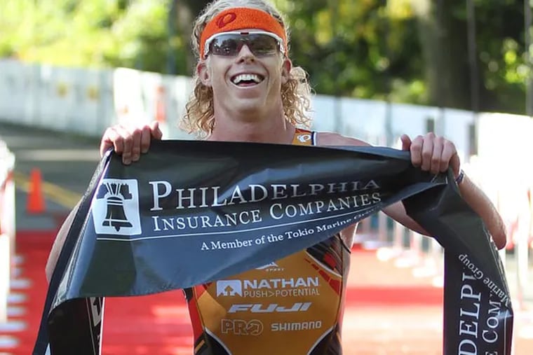 With a time of 1:49:03 Cameron Dye, finished the Philadelphia Triathlon in first place. (Michael Bryant/Staff Photographer)