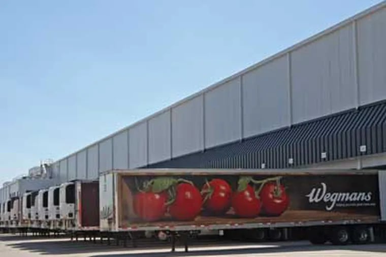 Semi-trailers line up to the loading docks of the new refrigerated distribution center for Wegman's in Pottsville, PA. ( MICHAEL BRYANT / Staff Photographer )