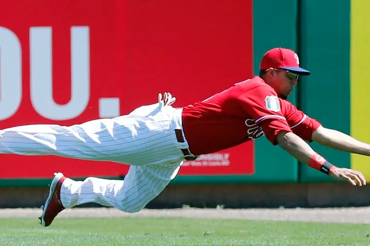 The Phillies' Aaron Altherr injured his left wrist on this play diving for the ball against Atlanta on Friday.