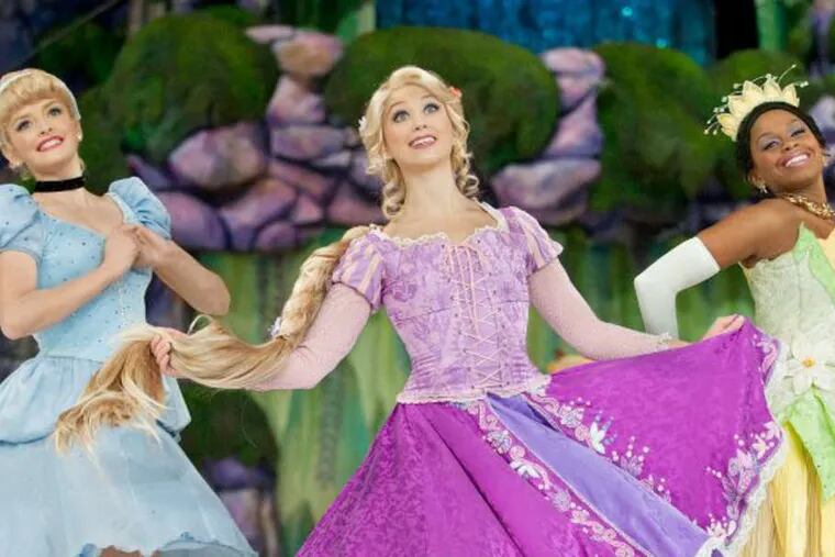 Rapunzel, Cinderella, and Princess Tiana in the ice-skating musical, running till Jan. 1 at Wells Fargo Center.