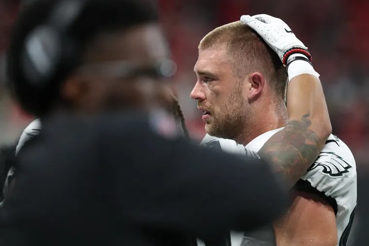 Eagles tight end Zach Ertz is comforted after he was short of the first down marker on 4th down in the 4th quarter. Philadelphia Eagles lost 24-20 to the Atlanta Falcons in Atlanta, GA on September 15, 2019. .