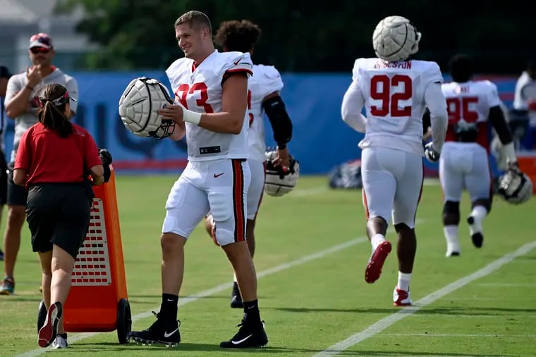 Linebacker Carl Nassib puts his helmet on before taking part in drills during the Buccaneers' joint practice with the Tennessee Titans on Wednesday in Nashville.