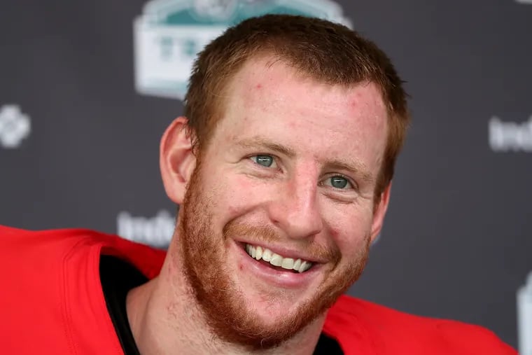 Eagles quarterback Carson Wentz smiles while answering a question during his news conference Tuesday.