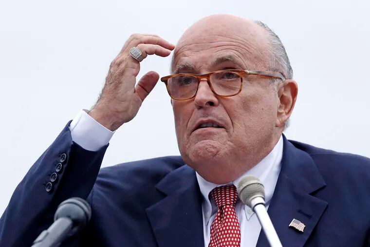 In this Aug. 1, 2018 file photo, Rudy Giuliani, an attorney for President Donald Trump, addresses a gathering during a campaign event for Eddie Edwards, who is running for the U.S. Congress, in Portsmouth, N.H.