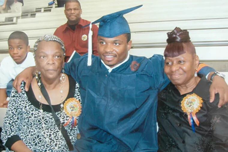 A photo of NFL prospect Curtis Brinkley with his two grandmothers at his Syracuse graduation. This picture was found in the home of his grandmother, Margie Cason.