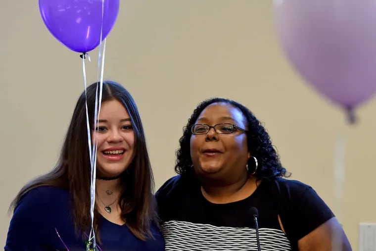 Ruby Morales-Negron (left), 17, and her new mother, Carly King (right), 29, speak during the celebration of children being adopted into their &quot;Forever Homes&quot; November 18, 2016.