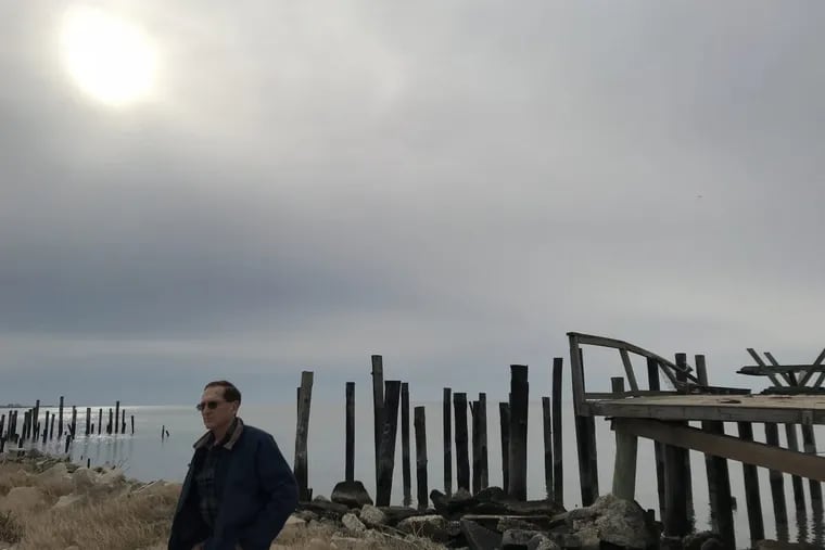 From 2018.: Elmer "Skip" Bowman in front of one of 20 homes razed in Lawrence Township, Cumberland County's Bay Point hamlet on the Delaware Bay.