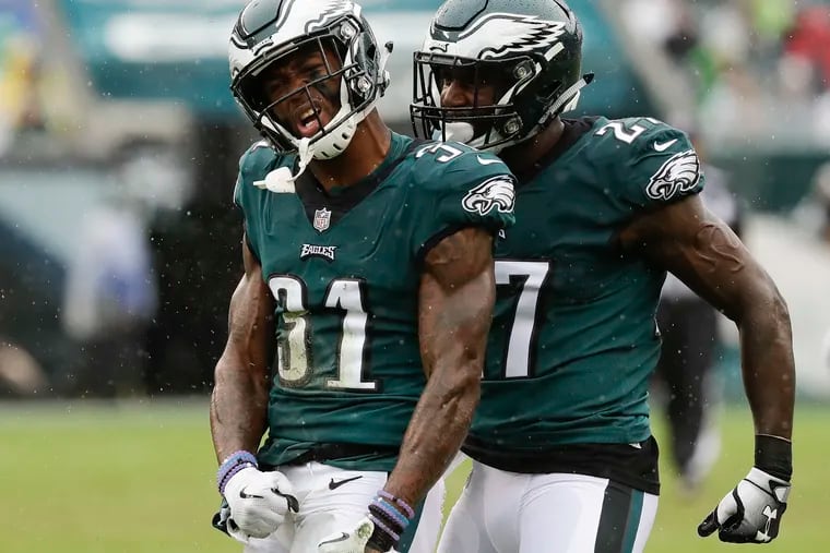 Eagles cornerback Jalen Mills (31) and safety Malcolm Jenkins celebrate a stop against the Indianapolis Colts in 2018.