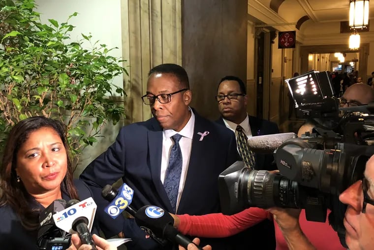 City Council President Darrell Clarke and Councilmember Maria Quiñones-Sanchez talking to reporters in city hall before the first council meeting for the fall session 2018 — 09/13/2018. Clarke telling reporters that negotiations over the construction impact tax between council and the mayor's office continue.