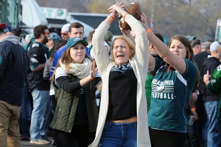 Tori Tankelewicz (center), of Mayfair, grimaces as she misses making the catch in the Linc parking lot before the game with the Bills. Breaking up the pass are Jordyn Jenkins (left) and Kelly McMenamin, who intercepted.