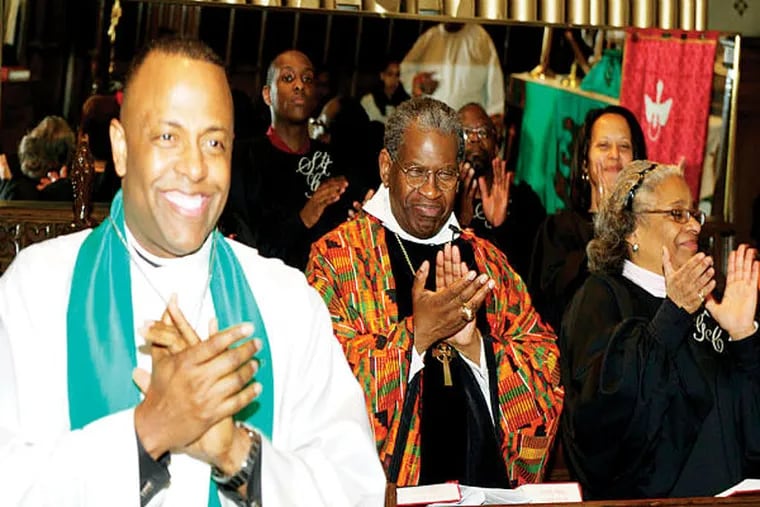 At the African Episcopal Church of St. Thomas, Father Martini Shaw (left) leads a dynamic church community that has rolled with the changes for the 221 years.