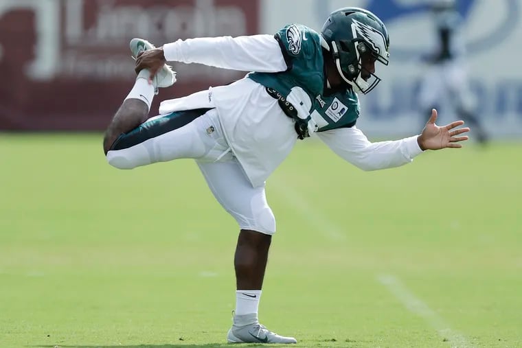 Boston Scott, shown stretching before a recent training camp practice, will open the season as the Eagles' No. 2 running back.