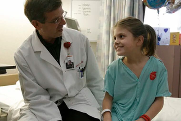 Dr. Robert Steckler talks with Caly Miccicke, above, after discharging her from St. Christopher&#0039;s Hospital for Children. At right, Caly and her mother, Amy, prepare to leave the hospital for the drive back to Bethlehem.