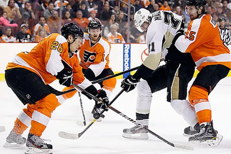 The Flyers lack a primary scorer such as Evgeni Malkin (center), but they still have a potent offense. (Yong Kim/Staff file photo)