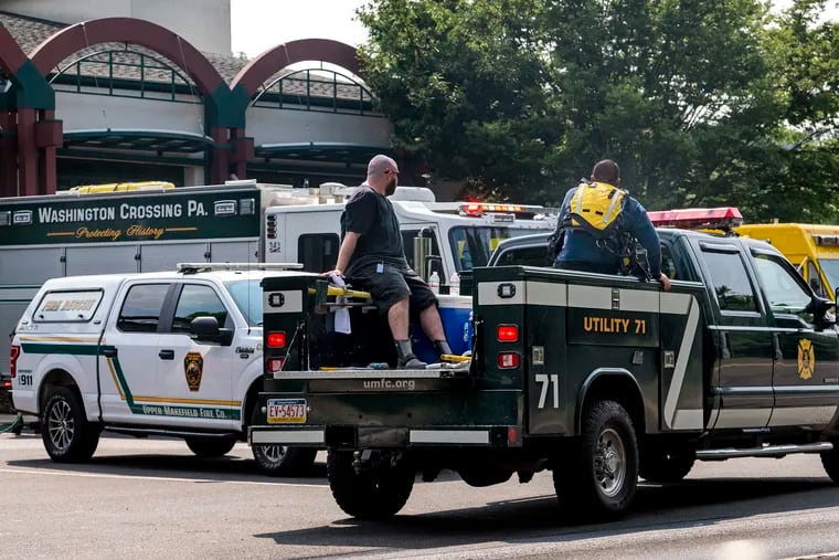 Searchers return to the staging area and command center at Upper Makefield Fire Company Station 71 in Washington Crossing Tuesday, July 18, 2023 as recovery efforts continue in the search for two children.
