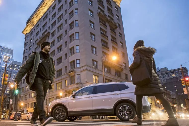At the intersection of 18th and Walnut automobile and pedestrians share the same space during rush hour in Philadelphia. MICHAEL BRYANT/ Staff Photographer